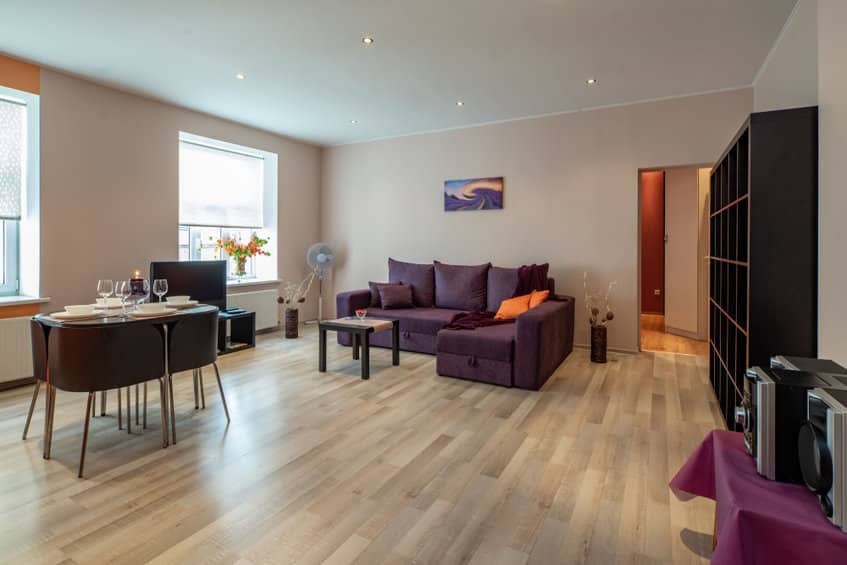 modern interior of spacious light studio apartment with furnitur