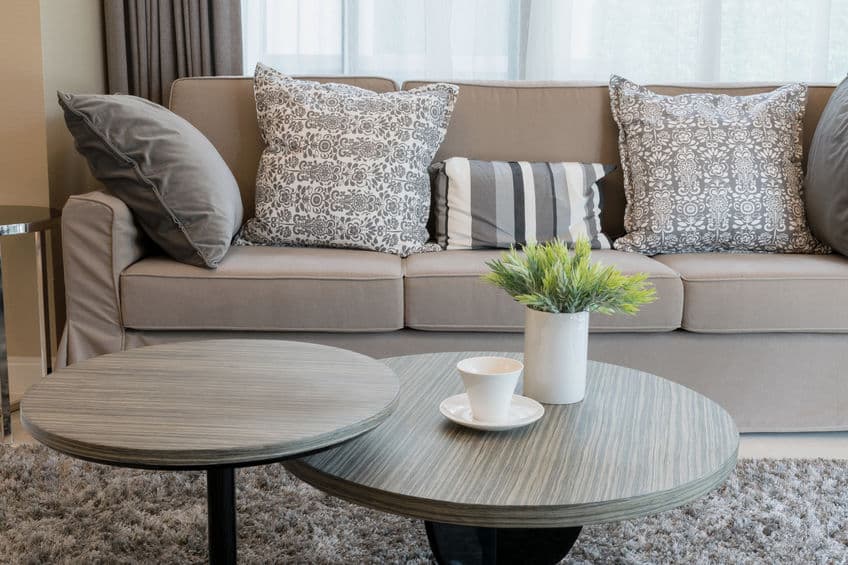 sturdy brown tweed sofa with grey patterned pillows