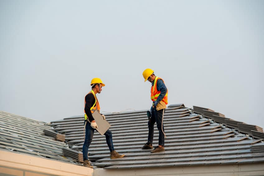 construction worker wearing safety harness belt during working o