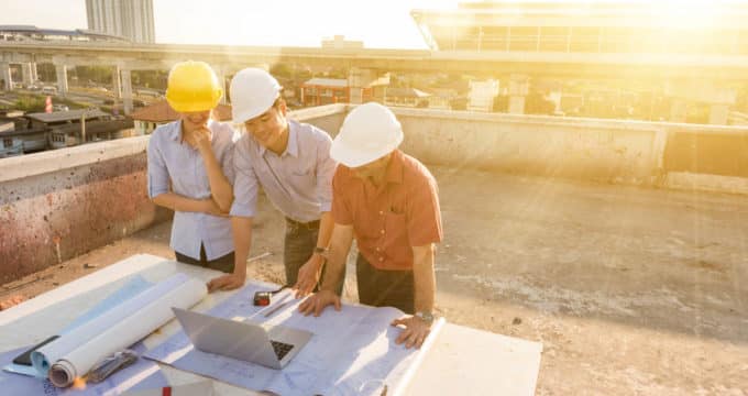 three construction engineer working in construction site, constr