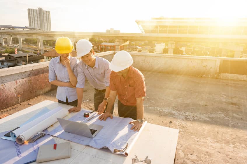 three construction engineer working in construction site, constr